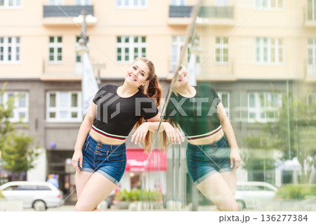 Happy teenager woman outside. Happy teenager woman outside. 136277384