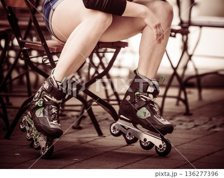 Woman riding roller skates 136277396