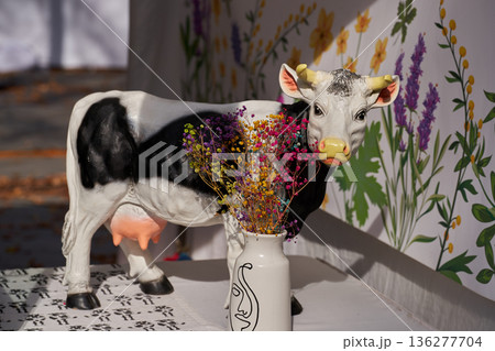 Cute figurines of cow made of clay, handmade. Crafts Fair. Travel souvenir. Cute figurines of cow made of clay, handmade. Crafts Fair. Travel souvenir. 136277704