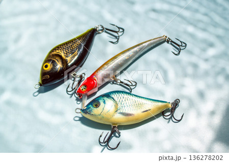 Fishing hobby concept. Accessories on blue background Fishing hobby concept. Accessories on blue background 136278202