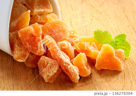 Closeup candied dried ginger in white bowl 136278304