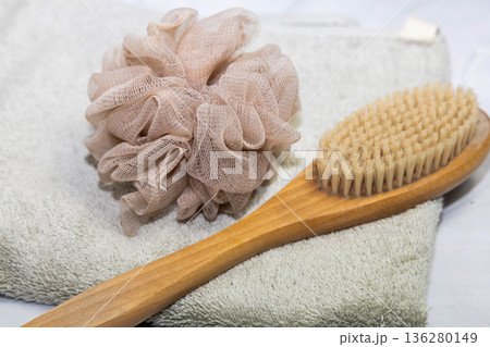 Natural bath accessories on light green towel. Natural bath accessories on light green towel. 136280149