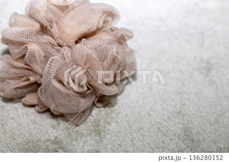 Natural bath accessories on light green towel. Natural bath accessories on light green towel. 136280152
