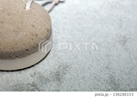 Natural bath accessories on light green towel. Natural bath accessories on light green towel. 136280153