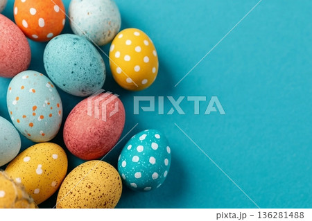 Easter eggs on a bright blue background. Easter celebration concept. Colorful easter handmade decorated Easter eggs. Place for text. Copy space. 136281488