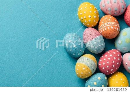 Easter eggs on a bright blue background. Easter celebration concept. Colorful easter handmade decorated Easter eggs. Place for text. Copy space. Easter eggs on a bright blue background. Easter celebration concept. Colorful easter handmade decorated Easter eggs. Place for text. Copy space. 136281489