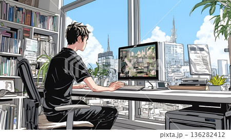 職場のデスクでパソコンに向かって仕事をしているビジネスマン