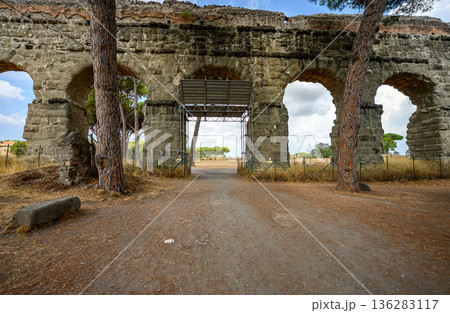 Historic Aqueduct Structure Surrounded by Landscape in Parco degli Acquedotti, Rome 136283117
