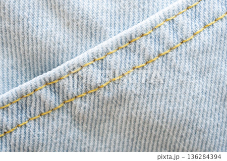 Old denim blue jeans fabric texture background close up 136284394