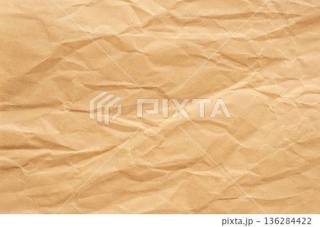 Abstract crumpled and creased recycle brown paper texture background Abstract crumpled and creased recycle brown paper texture background 136284422