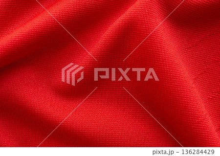 Red sports clothing fabric football shirt jersey texture close up Red sports clothing fabric football shirt jersey texture close up 136284429