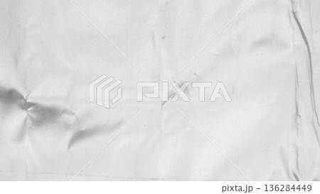 Crumpled shiny silver fabric metal texture background 136284449