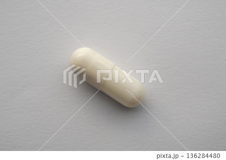 White medicine pill capsule on white background 136284480