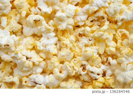 Tasty popcorn close up background top view Tasty popcorn close up background top view 136284546