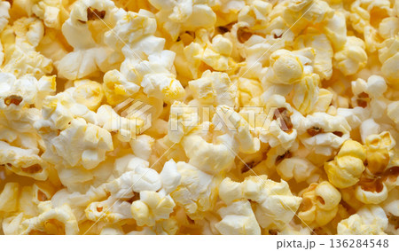 Tasty popcorn close up background top view Tasty popcorn close up background top view 136284548