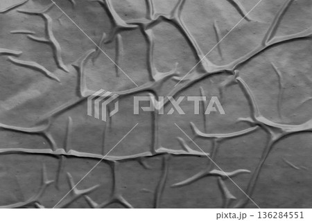 Gray crumpled and creased plastic poster texture background 136284551