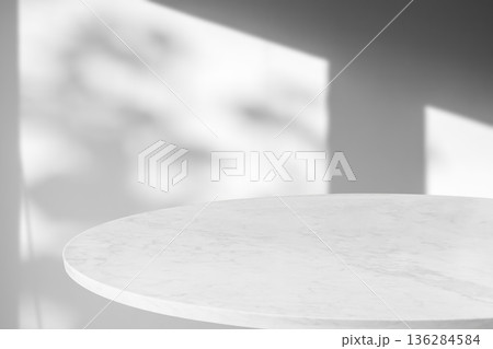 Round marble table top with tree leaves shadow drop on white wall background for mockup product display Round marble table top with tree leaves shadow drop on white wall background for mockup product display 136284584