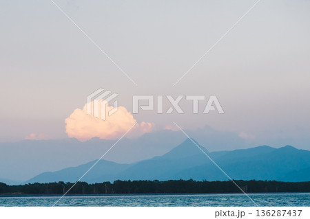 Soft Pastel Cloud Over Coastal Mountains at Dusk 136287437