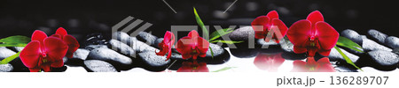 Panoramic Zen Spa Background with Vibrant Red Orchids and Wet Black Stones with Water Reflection Panoramic Zen Spa Background with Vibrant Red Orchids and Wet Black Stones with Water Reflection 136289707