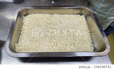 Fresh White Panko Breadcrumbs in a Stainless Steel Tray for Professional Food Preparation 136290732