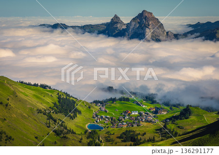 Green fields above the misty valley, Stoos village, Switzerland 136291177