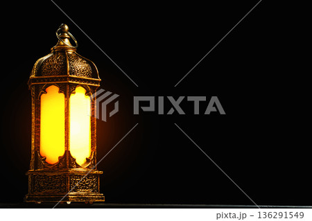 Glowing Islamic Lantern on Black Background with Copy Space. Minimalist Religious Concept for Ramadan and Eid. High quality photo 136291549