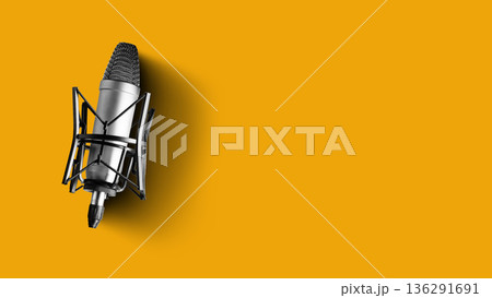 Podcast recording setup with microphone in studio against yellow background 136291691