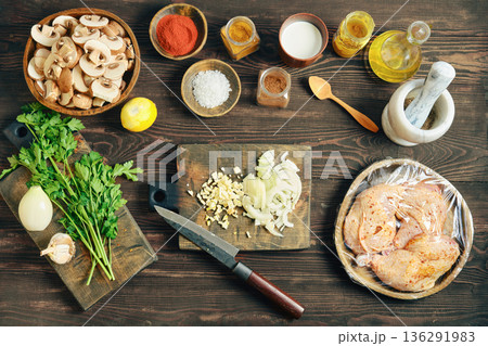 Chopped white onion and garlic on wooden cutting board Chopped white onion and garlic on wooden cutting board 136291983