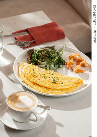 Breakfast omelette with shrimp salad and coffee 136294042