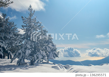 Pristine winter mountain views reveal snow-covered peaks and untouched alpine landscapes in the Sierra Nevada, Spain. Pristine winter mountain views reveal snow-covered peaks and untouched alpine landscapes in the Sierra Nevada, Spain. 136295571
