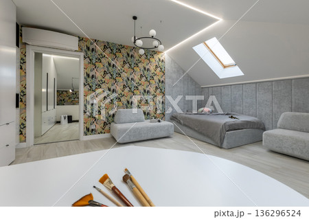 Modern Attic Studio Apartment with Minimalist Bedroom and Workspace 136296524