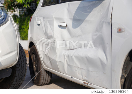Car accident damage after collision on urban road Car accident damage after collision on urban road 136296564