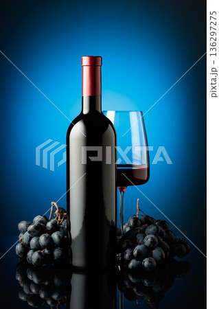 Red wine and juicy blue grapes. Red wine and juicy blue grapes. 136297275