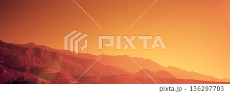 Silhouette of mountains against the orange sunset sky. Horizontal banner Silhouette of mountains against the orange sunset sky. Horizontal banner 136297703