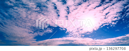 Blue cloudy sky at sunset. Gradient color. Sky texture. Abstract nature background. Horizontal banner Blue cloudy sky at sunset. Gradient color. Sky texture. Abstract nature background. Horizontal banner 136297708