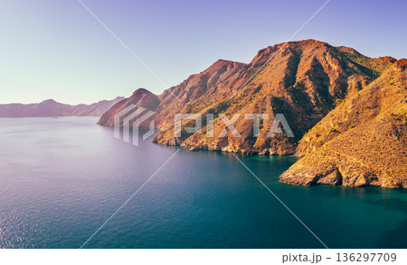 Panorama of the rock in the sea Aerial view. Cabo de Gata-Nijar reserve. El Portus, Almeria Andalusia Spain Horizontal banner Panorama of the rock in the sea Aerial view. Cabo de Gata-Nijar reserve. El Portus, Almeria Andalusia Spain Horizontal banner 136297709