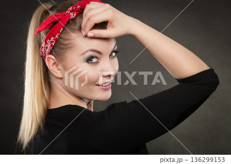 Portrait of retro pin up girl in red handkerchief. 136299153