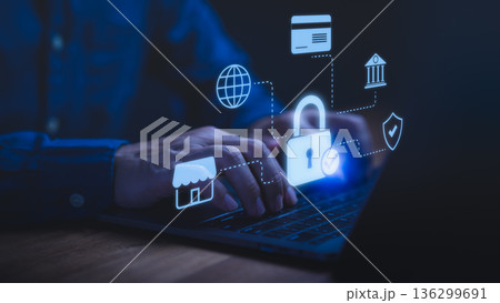 Person using a laptop computer with glowing lock and fintech icons, symbolizing cybersecurity, online banking protection, secure payment, data privacy, financial safety, and internet security concept. 136299691