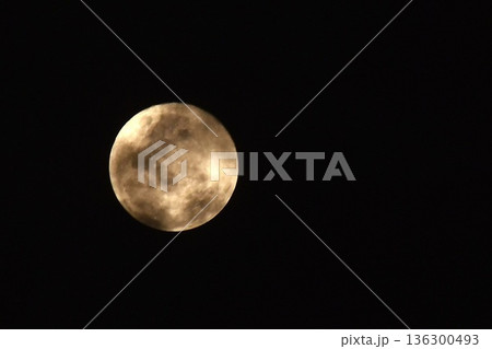 full moon covering by cloud floating on sky in night background 136300493