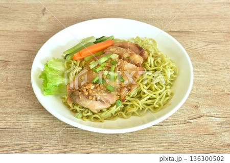 Chinese vegetable noodles slice grilled chicken with Teriyaki Japanese sauce and cabbage on plate Chinese vegetable noodles slice grilled chicken with Teriyaki Japanese sauce and cabbage on plate 136300502