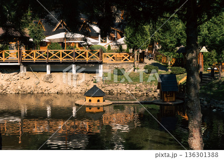 Wooden Lakeside Restaurant Terrace in Mountain Resort Wooden Lakeside Restaurant Terrace in Mountain Resort 136301388