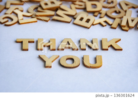 Thank you text made of wooden letters on white background representing appreciation gratitude and positive communication concept. 136301624