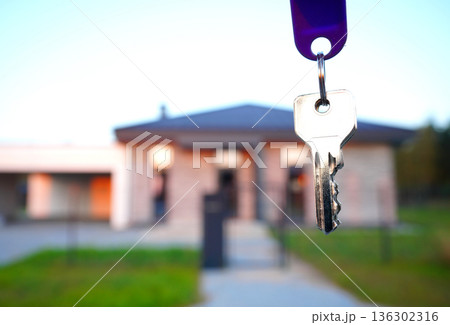 Keys for new house. Keys for  house facade after buying. Buying suburb home, villa rent. House key.  136302316