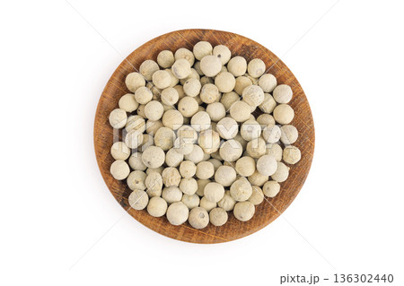 White peppercorns or pepper in wooden bowl isolated on white background. Top view. Flat lay White peppercorns or pepper in wooden bowl isolated on white background. Top view. Flat lay 136302440