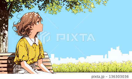 公園のベンチでひとり静かにくつろぐ若い女性