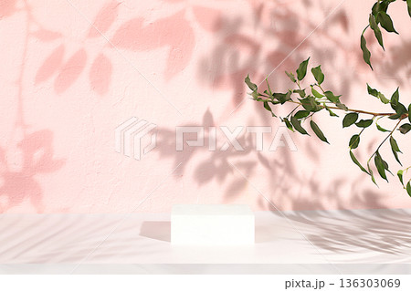 Premium empty podium with shadows of tropical palm leaves on sunny wall, minimal abstract background for cosmetics product presentation, design template, podium on pedestal, selective focus. 136303069