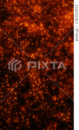 Warm orange glitter particles and glowing sparks floating in dark space, festive bokeh abstract background 136303952