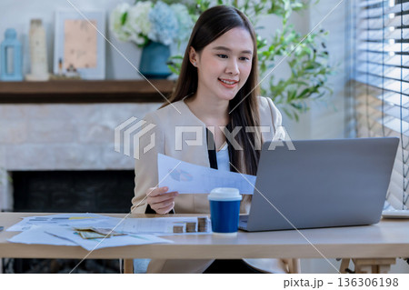 Business woman at desk in office for celebration of goals or target.  136306198