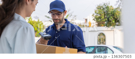 Delivery express courier young man use giving boxes or Food to woman customer  at front home.  136307503
