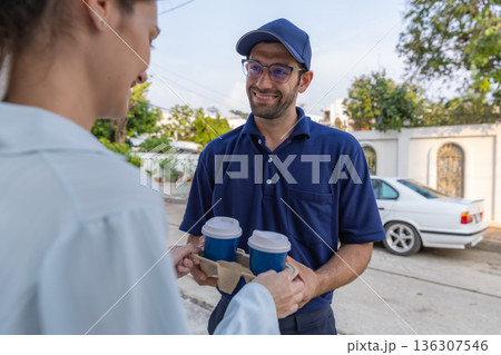 Delivery express courier young man use giving boxes or Food to woman customer  at front home.  136307546